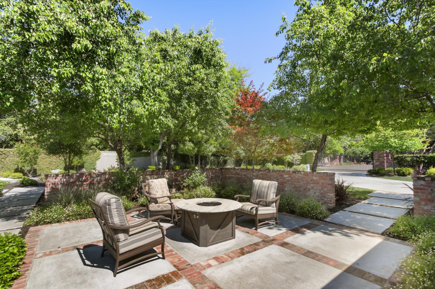 495 Bret Harte Road Sacramento, CA 95864 - Photo 65 of 84 a view of a patio with table and chairs potted plants and tree
