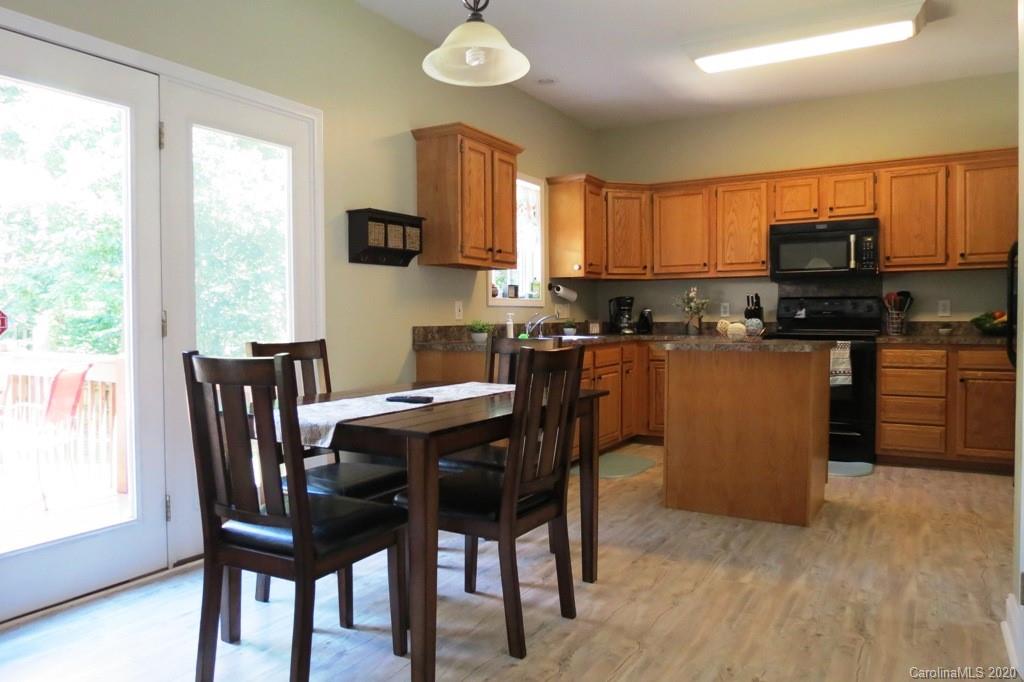 1173 Timber Spring Lane Salisbury, NC 28147 - Photo 16 of 38 a view of a dining room with furniture window and outside view