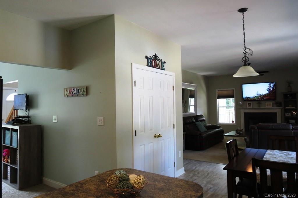 1173 Timber Spring Lane Salisbury, NC 28147 - Photo 19 of 38 a bedroom with furniture and a chandelier