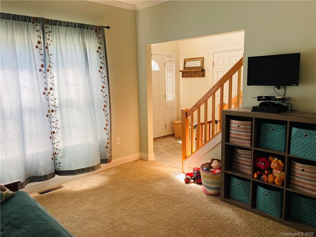 1173 Timber Spring Lane Salisbury, NC 28147 - Photo 20 of 38 a view of a livingroom with an empty space and a fireplace