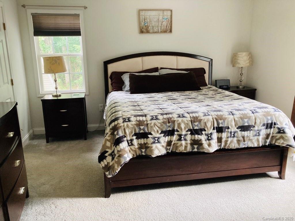 1173 Timber Spring Lane Salisbury, NC 28147 - Photo 25 of 38 a bed sitting in a bedroom next to a window