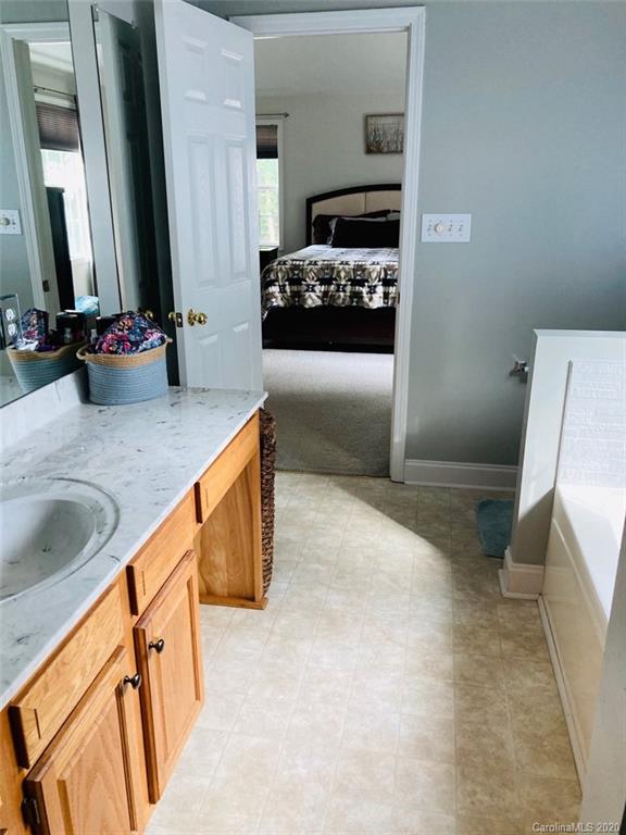 1173 Timber Spring Lane Salisbury, NC 28147 - Photo 26 of 38 a bedroom with a bed and a sink