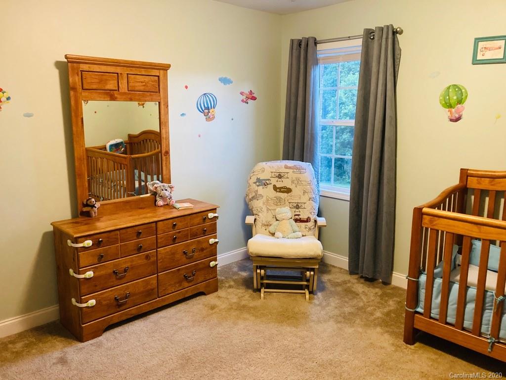 1173 Timber Spring Lane Salisbury, NC 28147 - Photo 37 of 38 a room with furniture and baby crib