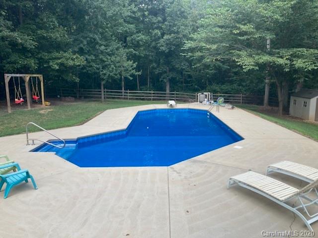 1173 Timber Spring Lane Salisbury, NC 28147 - Photo 10 of 38 a view of backyard with swimming pool and seating space