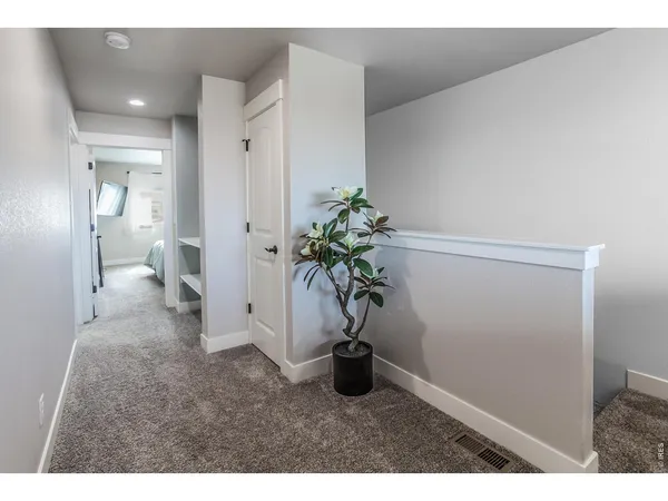 a bathroom with a toilet and a mirror