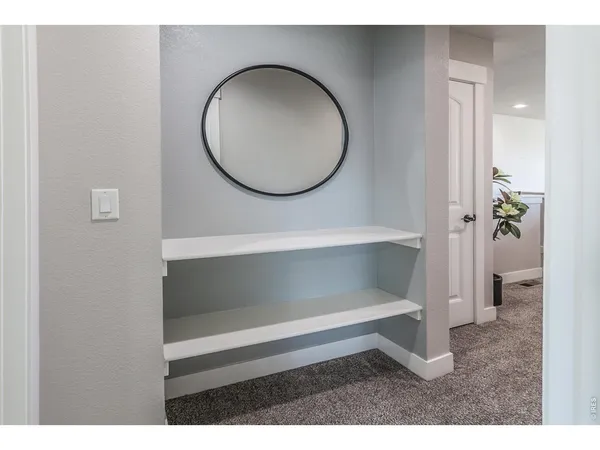 a bed room with a bed and a chandelier