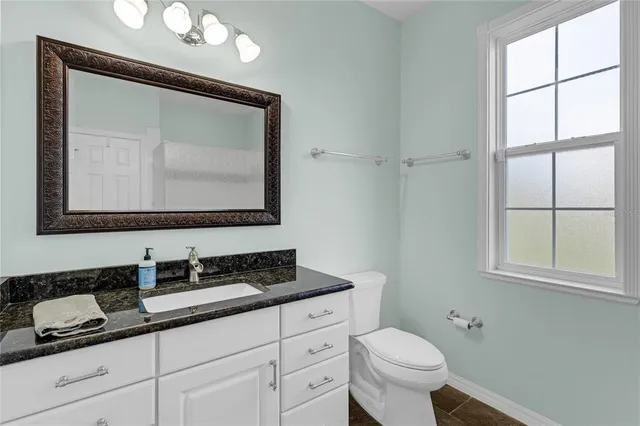 a view of a patio with a backyard dining table and chairs