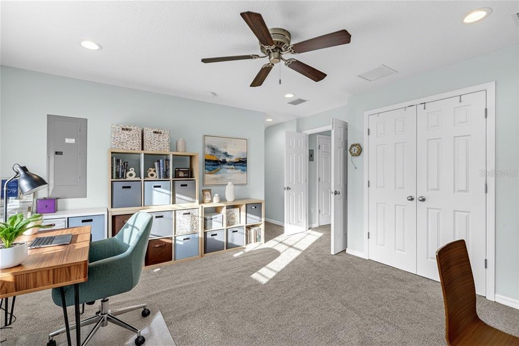 5608 Strong Point Weirsdale, FL 32195 - Photo 30 of 71 a living room with furniture and a large window