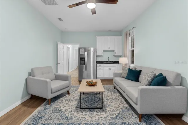 a view of a swimming pool with a bench in front of house