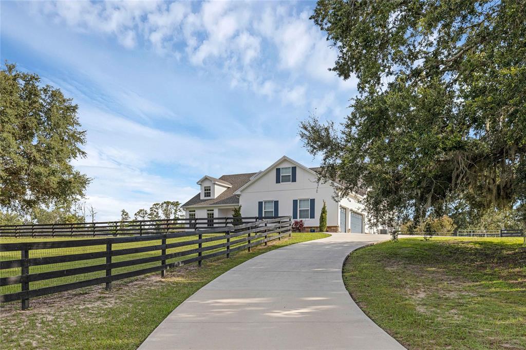 5608 Strong Point Weirsdale, FL 32195 - Photo 39 of 71 a view of a street with houses on both side