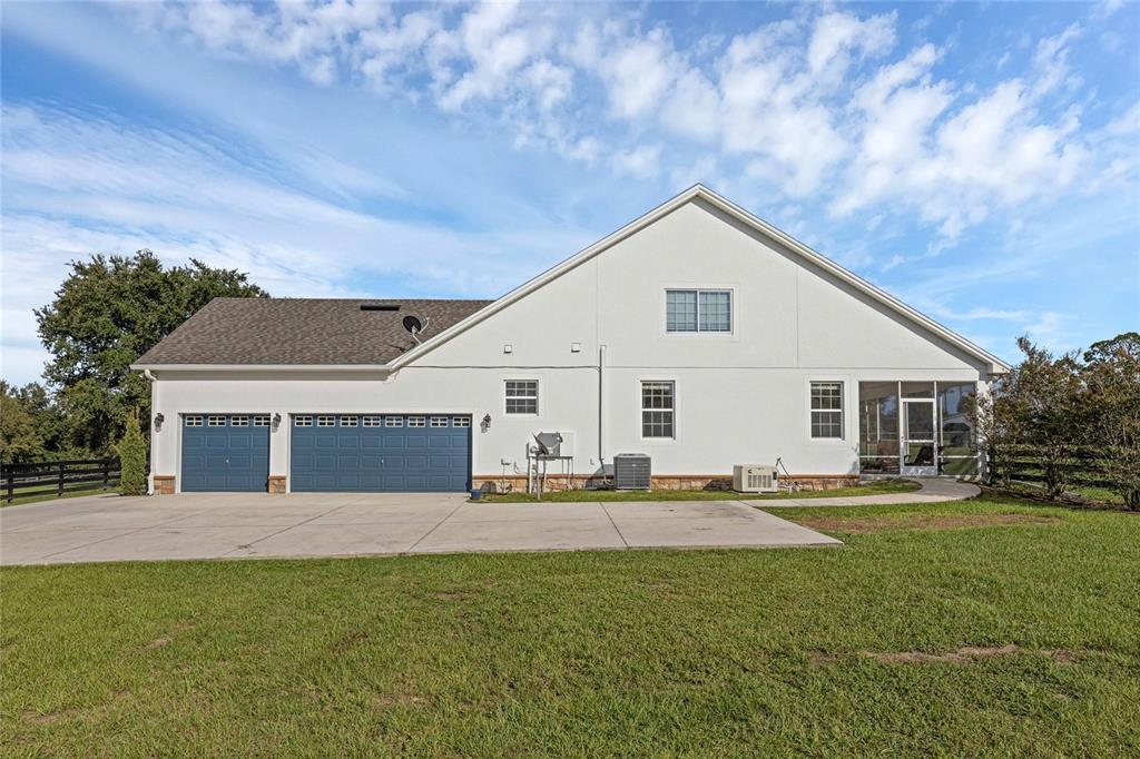 5608 Strong Point Weirsdale, FL 32195 - Photo 41 of 71 a front view of house with yard and green space