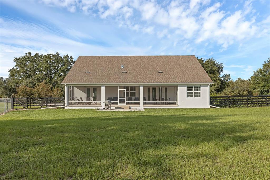5608 Strong Point Weirsdale, FL 32195 - Photo 42 of 71 a aerial view of a house with a big yard