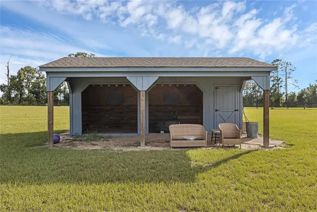 an aerial view of a houses with outdoor space