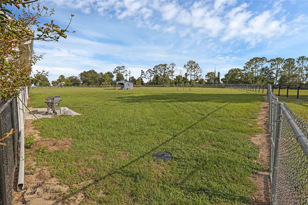 5608 Strong Point Weirsdale, FL 32195 - Photo 47 of 71 a view of a lake with a big yard