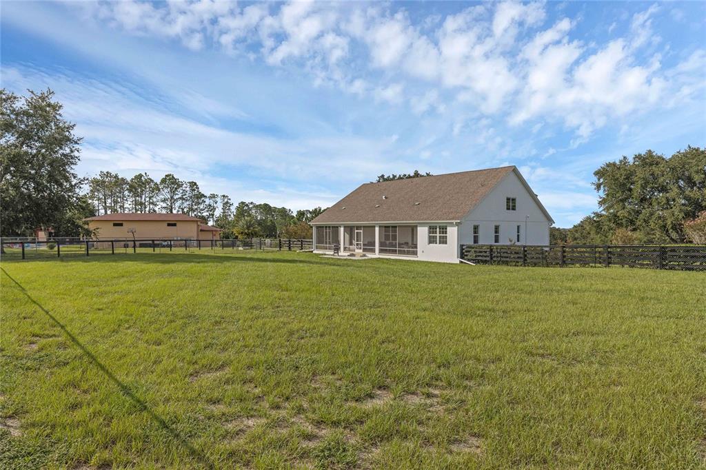 5608 Strong Point Weirsdale, FL 32195 - Photo 49 of 71 a front view of a house with garden