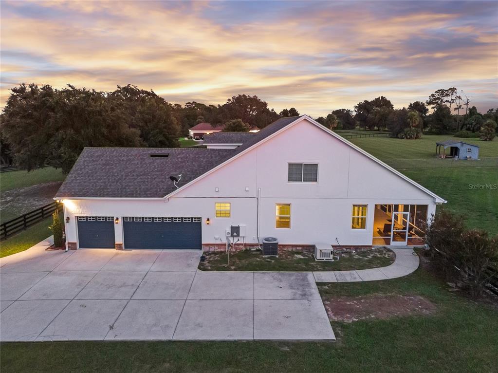 5608 Strong Point Weirsdale, FL 32195 - Photo 50 of 71 a aerial view of a house next to a yard