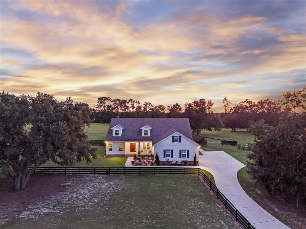 5608 Strong Point Weirsdale, FL 32195 - Photo 51 of 71 an aerial view of a house with a garden