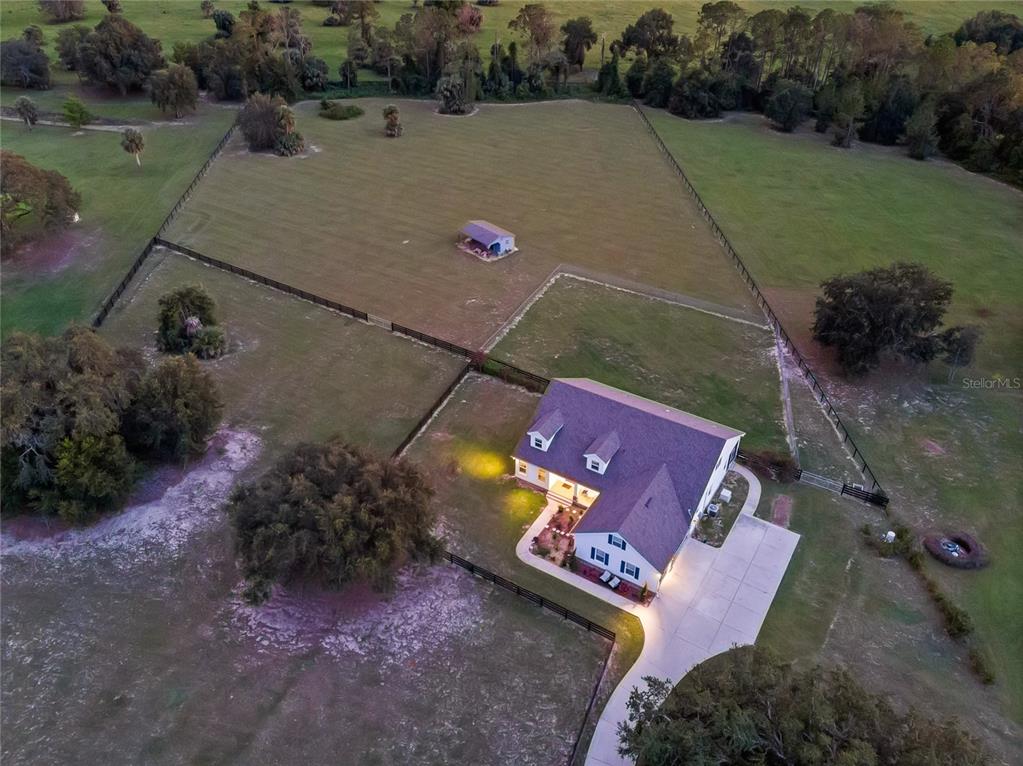 5608 Strong Point Weirsdale, FL 32195 - Photo 54 of 71 an aerial view of a house with a yard