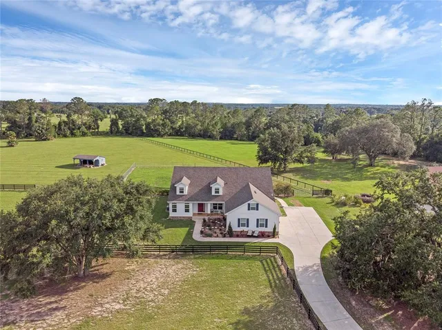 a aerial view of a house with a lake view