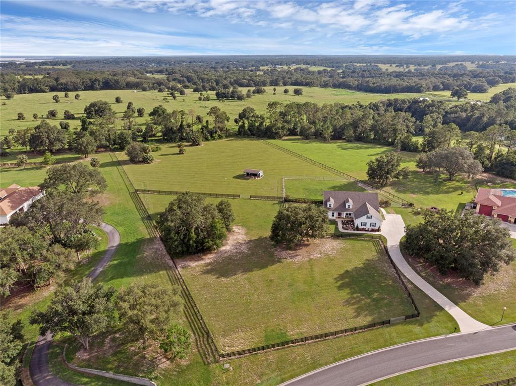 5608 Strong Point Weirsdale, FL 32195 - Photo 58 of 71 an aerial view of a residential houses with outdoor space
