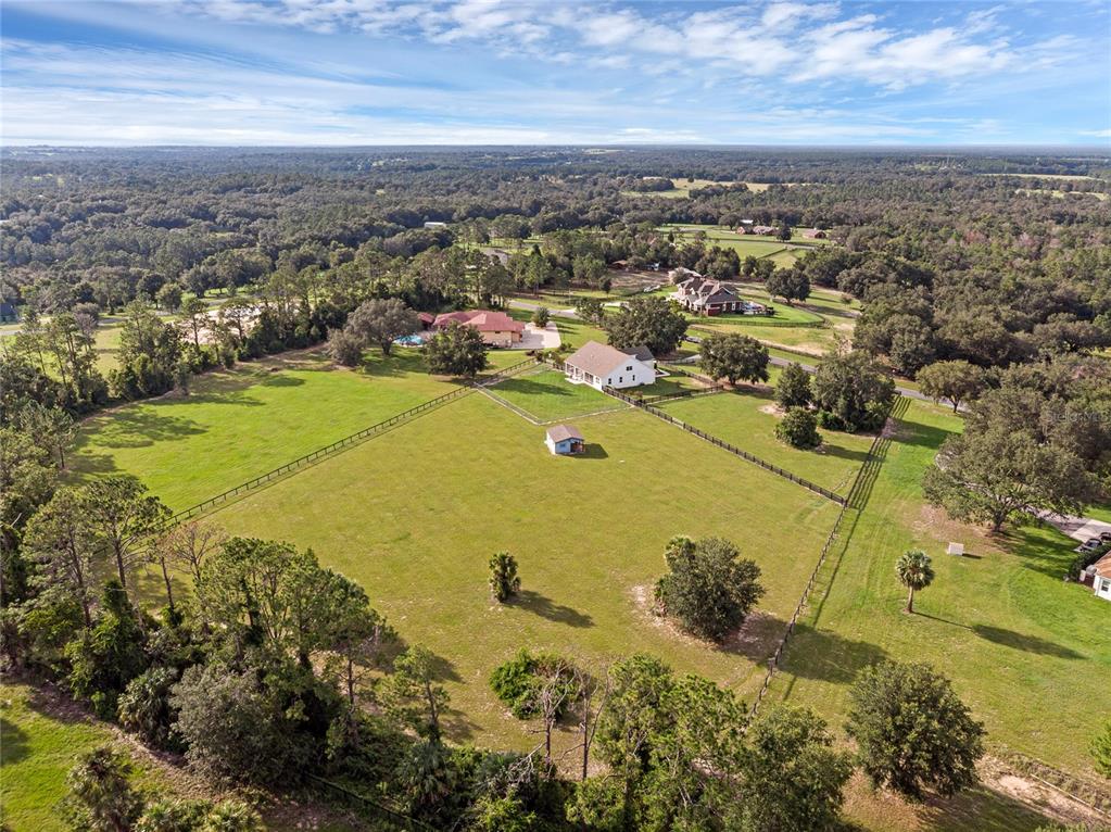 5608 Strong Point Weirsdale, FL 32195 - Photo 63 of 71 an aerial view of residential houses with outdoor space