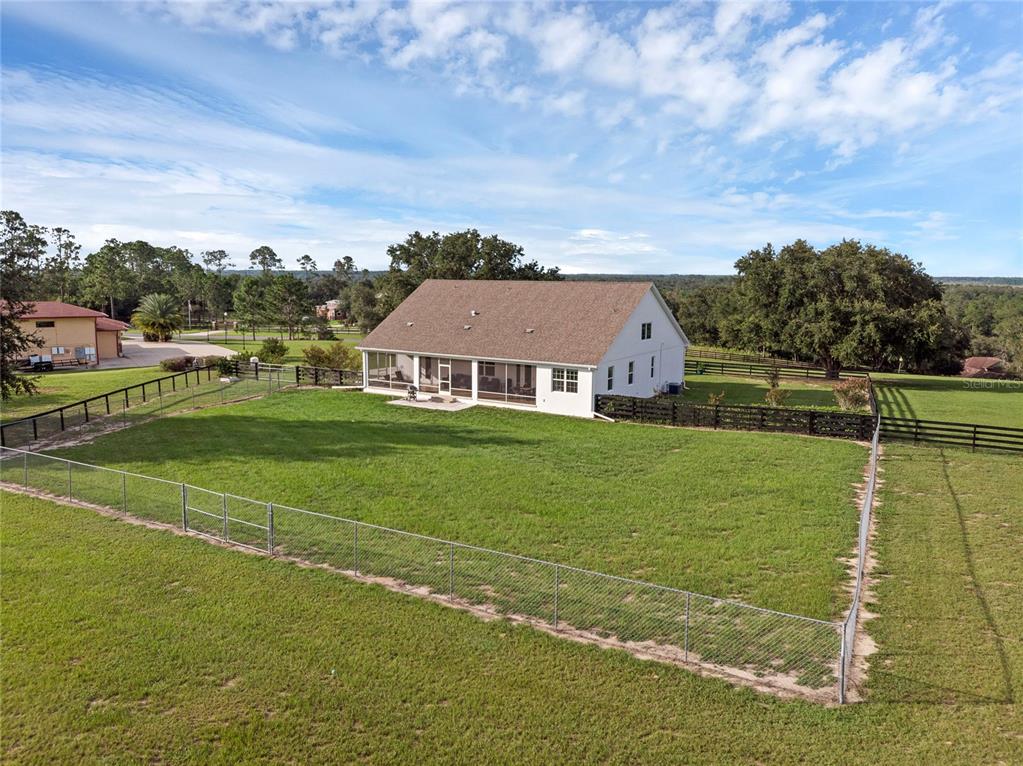 5608 Strong Point Weirsdale, FL 32195 - Photo 65 of 71 a view of a house with a big yard
