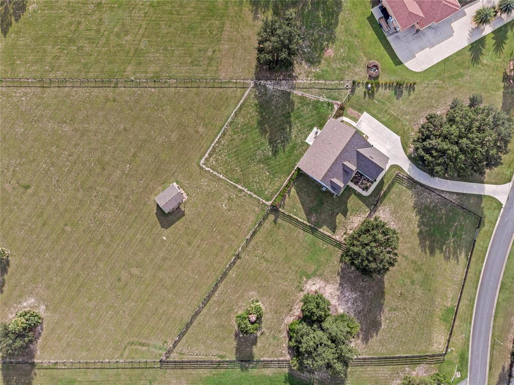 5608 Strong Point Weirsdale, FL 32195 - Photo 67 of 71 a aerial view of a house with a lake view