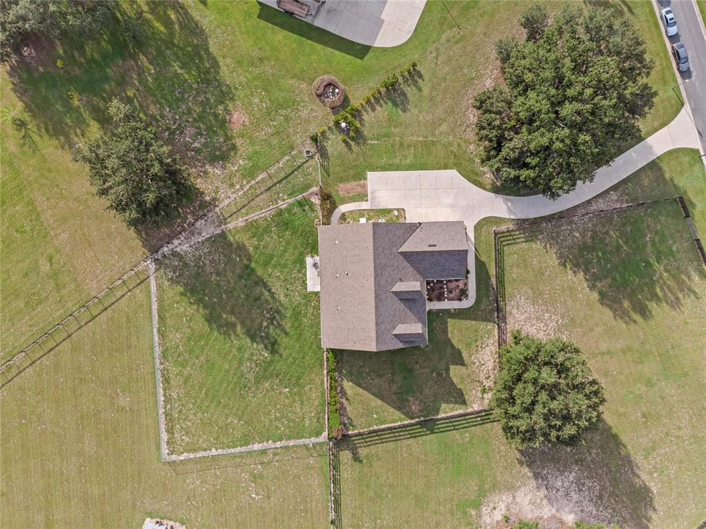 5608 Strong Point Weirsdale, FL 32195 - Photo 69 of 71 an aerial view of a house with a yard