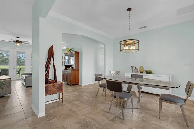 a kitchen with stainless steel appliances granite countertop a stove refrigerator and microwave