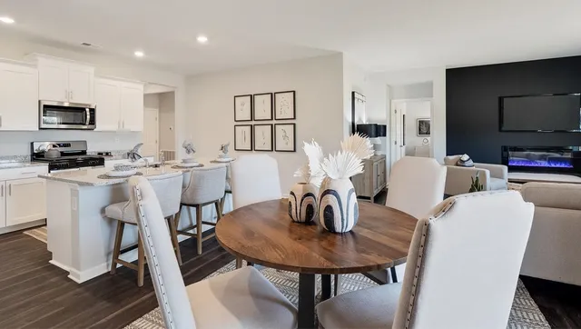 a dining room with furniture and window