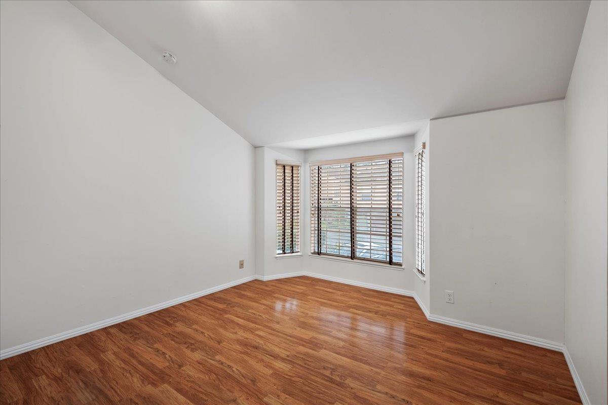 36 Holmes Drive San Jose, CA 95127 - Photo 22 of 29 an empty room with wooden floor and windows