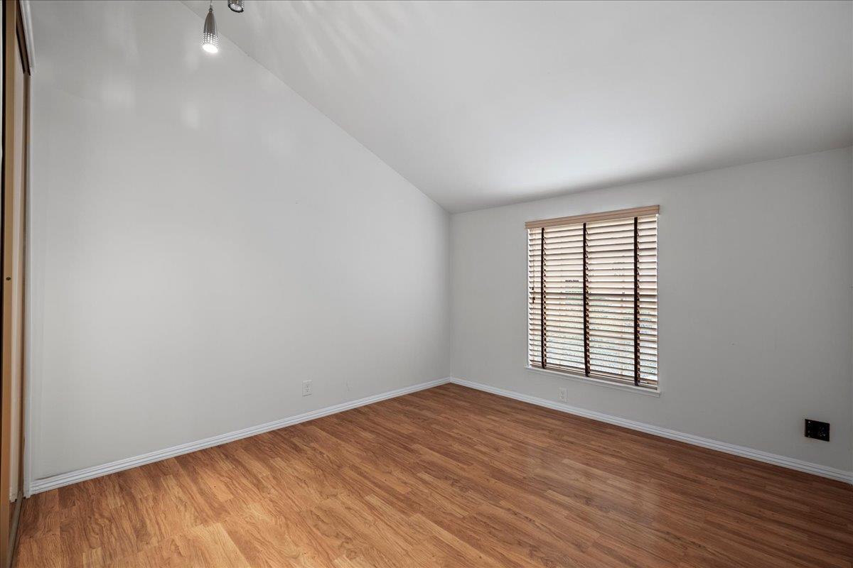 36 Holmes Drive San Jose, CA 95127 - Photo 23 of 29 an empty room with wooden floor and windows