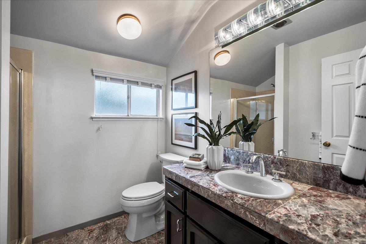 36 Holmes Drive San Jose, CA 95127 - Photo 24 of 29 a bathroom with a granite countertop sink a toilet and a mirror
