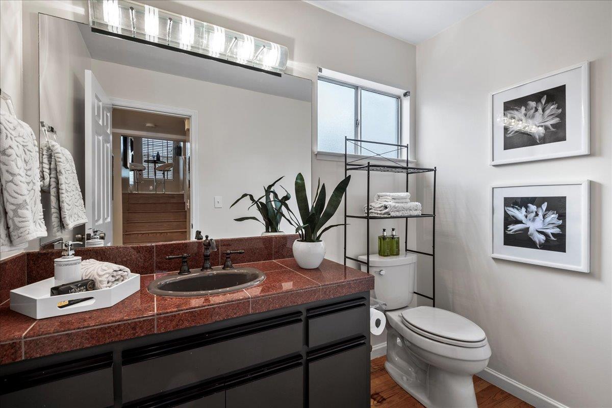 36 Holmes Drive San Jose, CA 95127 - Photo 25 of 29 a bathroom with a toilet a sink and mirror
