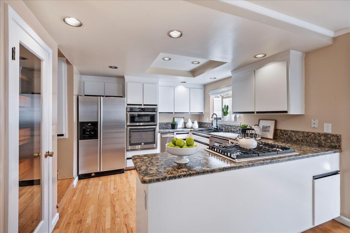 36 Holmes Drive San Jose, CA 95127 - Photo 5 of 29 a kitchen with stainless steel appliances granite countertop a refrigerator a stove and a sink