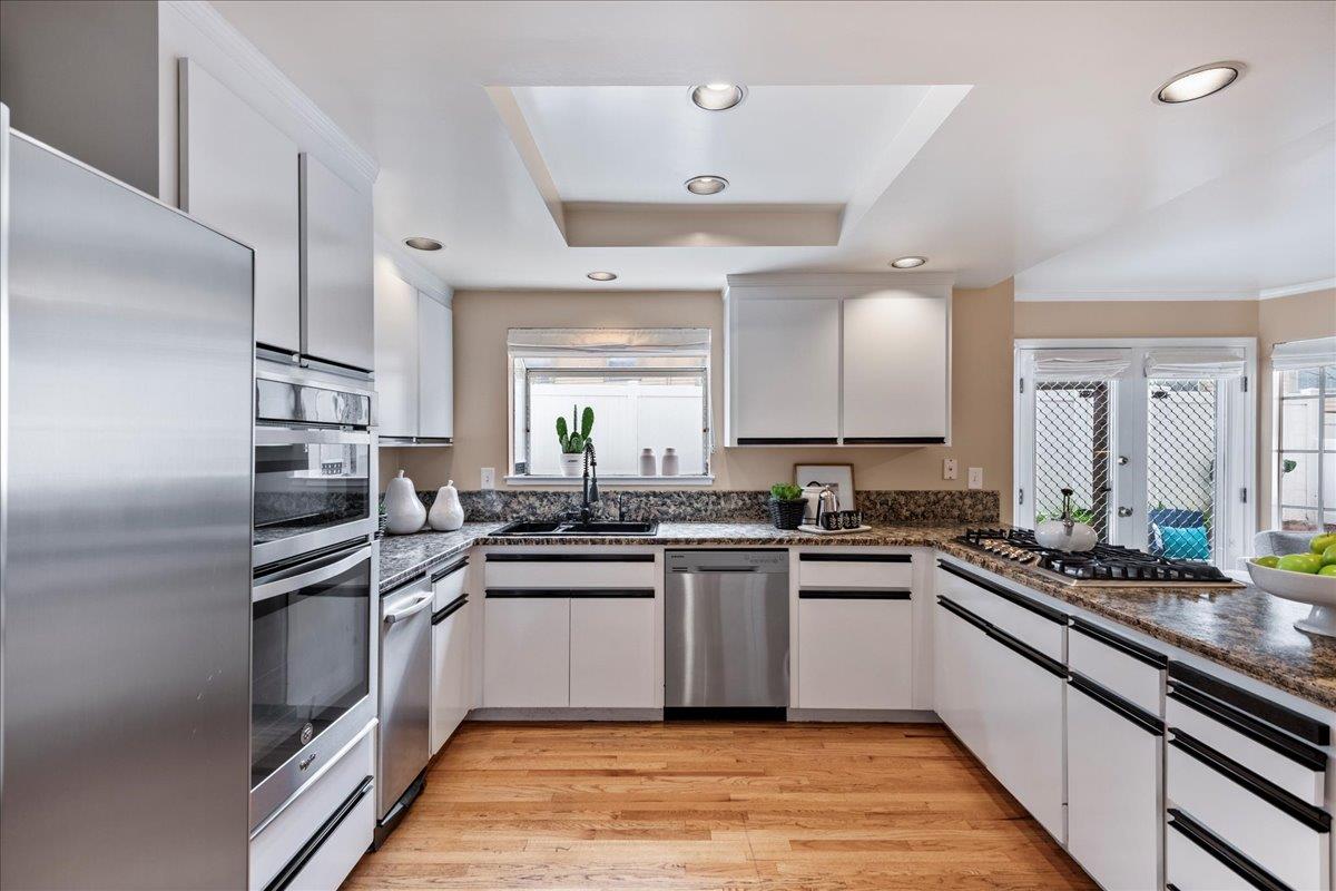 36 Holmes Drive San Jose, CA 95127 - Photo 6 of 29 a kitchen with stainless steel appliances granite countertop a sink and stove top oven