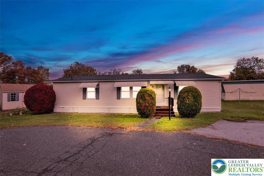 a view of a house with outdoor space and sitting area