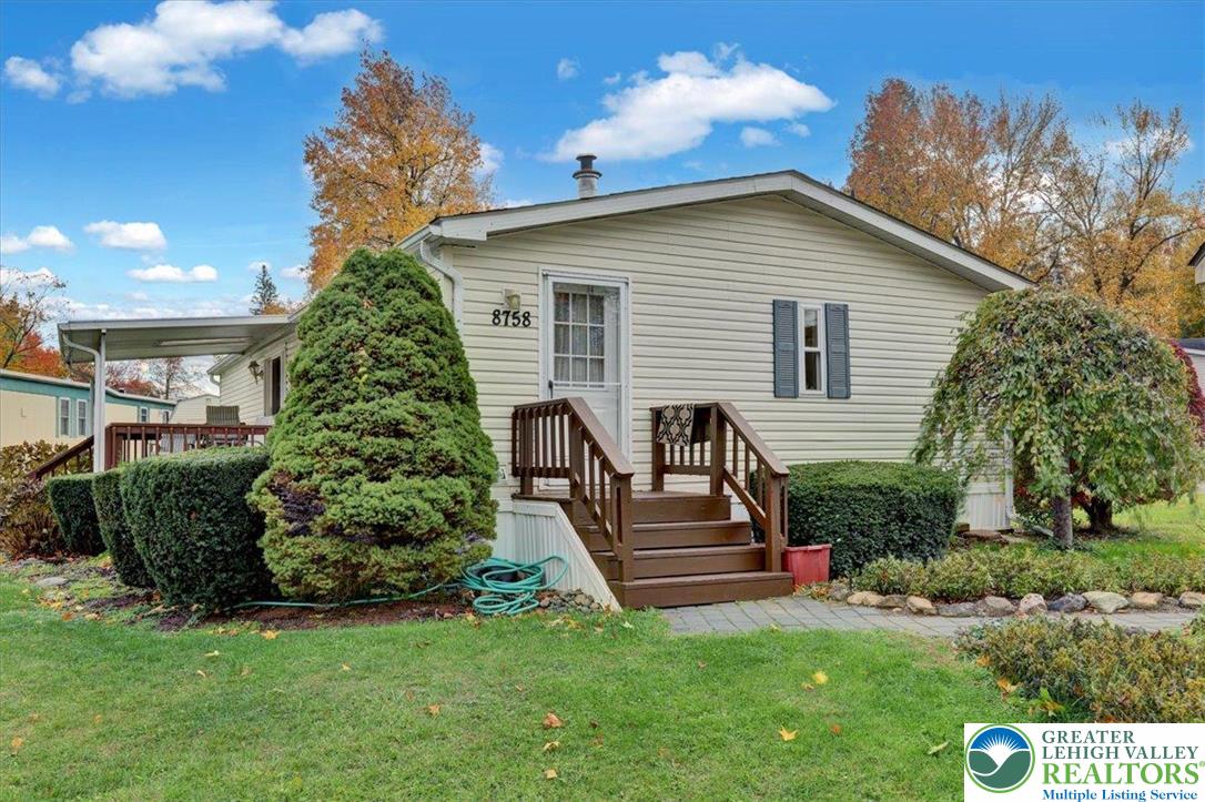 8758 Turkey Ridge Road, Unit 180 Breinigsville, PA 18031 - Photo 8 of 28 a view of a house with backyard and sitting area