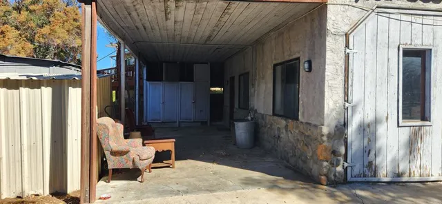 a view of balcony with furniture and shower