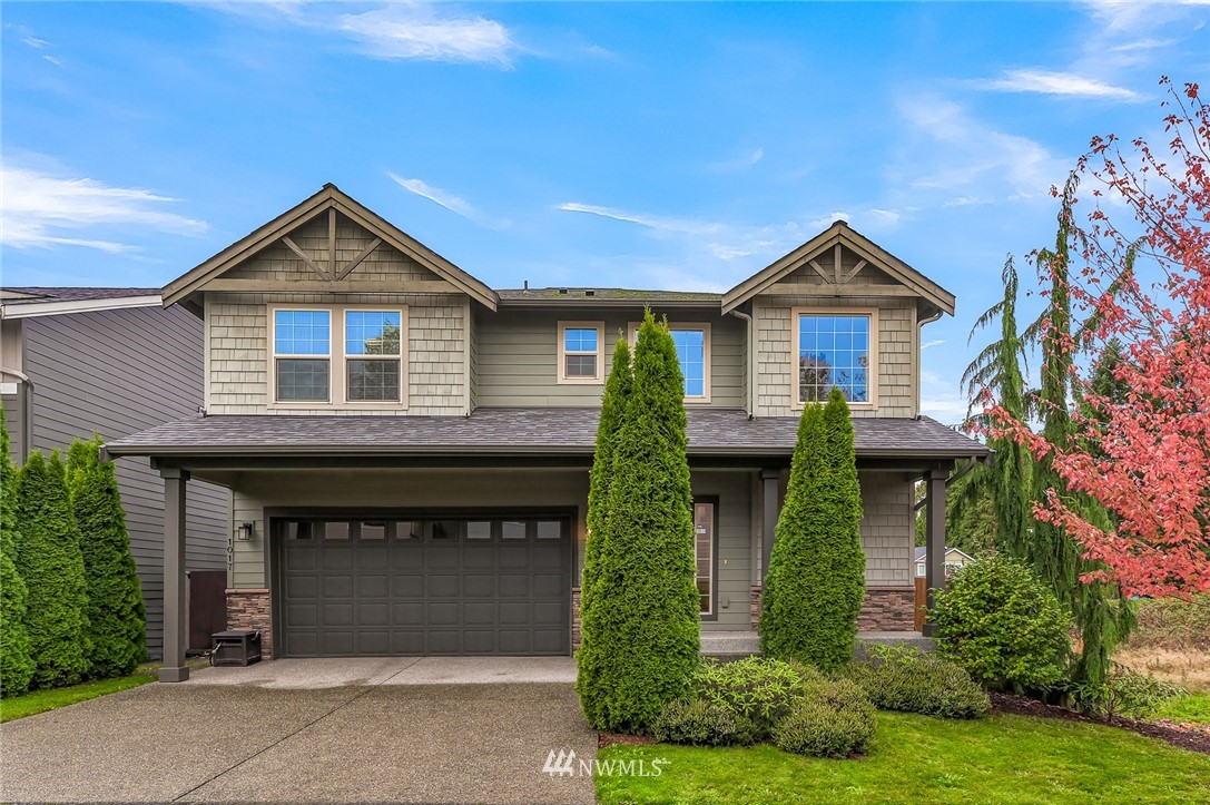 1017 Chelan Place Northeast Renton, WA 98059 - Photo 1 of 40 a front view of a house with garden