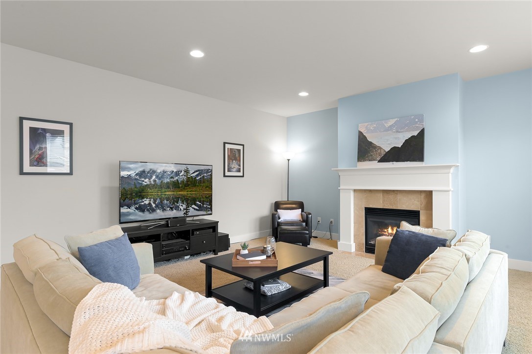 1017 Chelan Place Northeast Renton, WA 98059 - Photo 21 of 40 a living room with furniture and a fireplace
