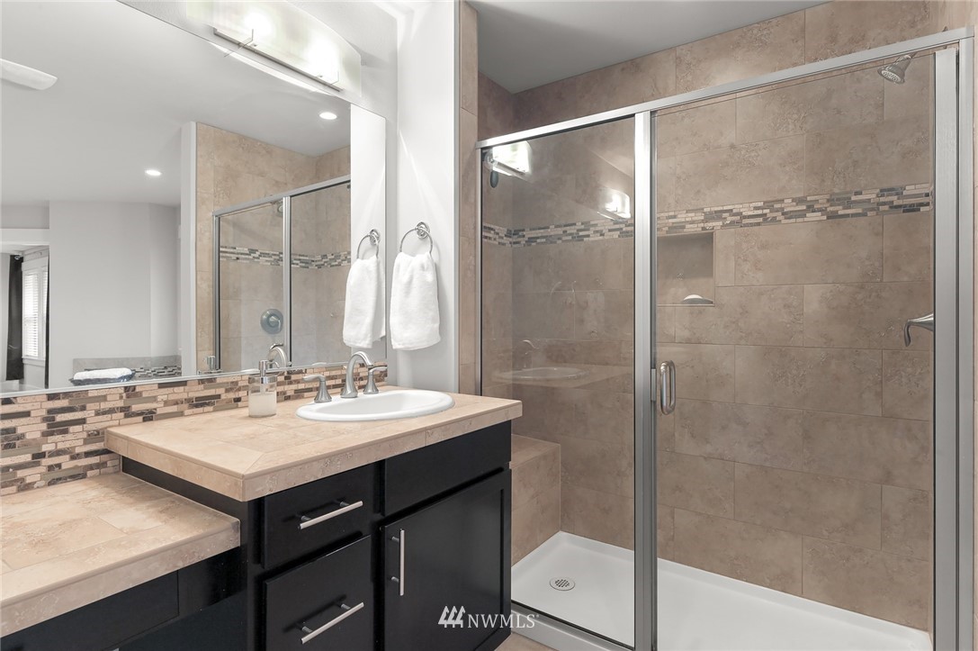 1017 Chelan Place Northeast Renton, WA 98059 - Photo 30 of 40 a bathroom with a sink and a mirror