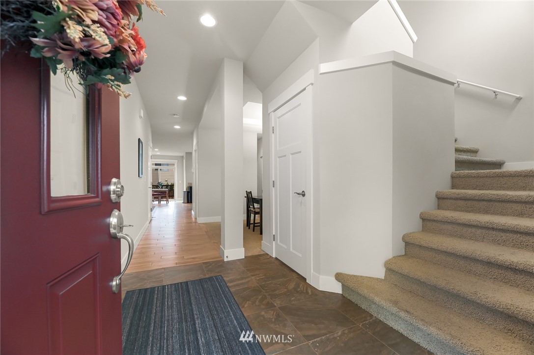 1017 Chelan Place Northeast Renton, WA 98059 - Photo 4 of 40 a view of a hallway with wooden floor and staircase