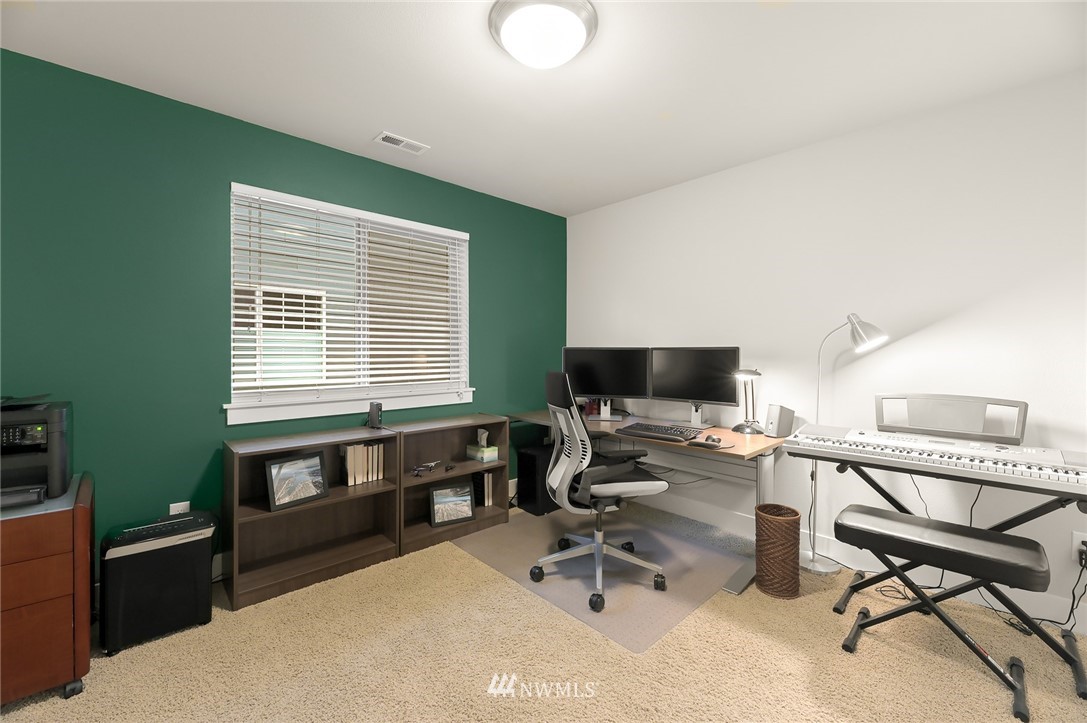 1017 Chelan Place Northeast Renton, WA 98059 - Photo 36 of 40 a workspace with furniture and a window