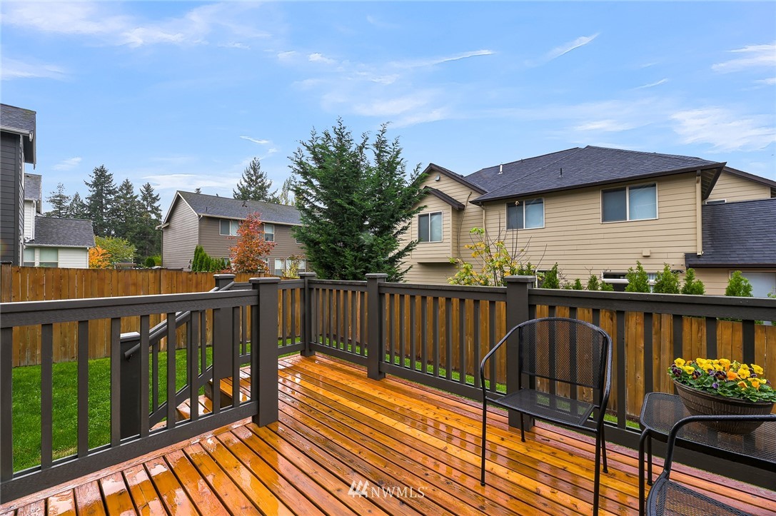 1017 Chelan Place Northeast Renton, WA 98059 - Photo 38 of 40 a view of a roof deck with wooden fence and wooden floor