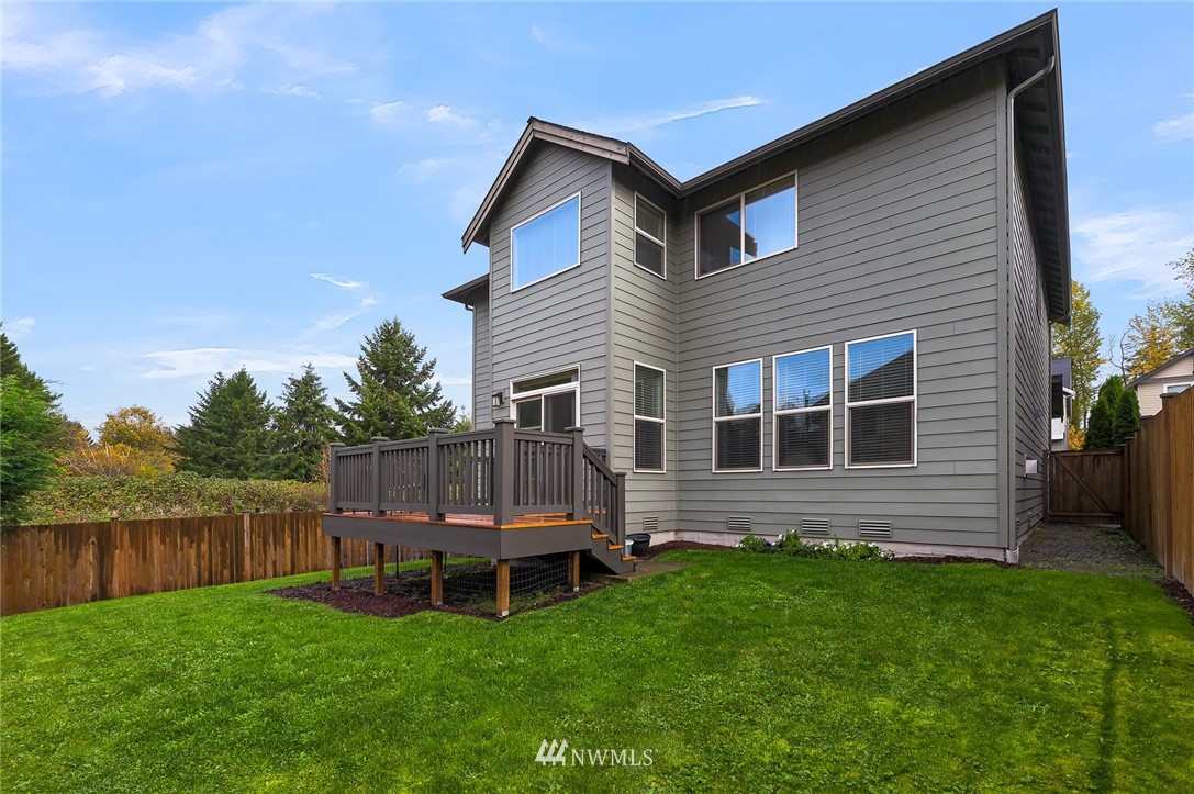 1017 Chelan Place Northeast Renton, WA 98059 - Photo 39 of 40 a view of a house with a backyard