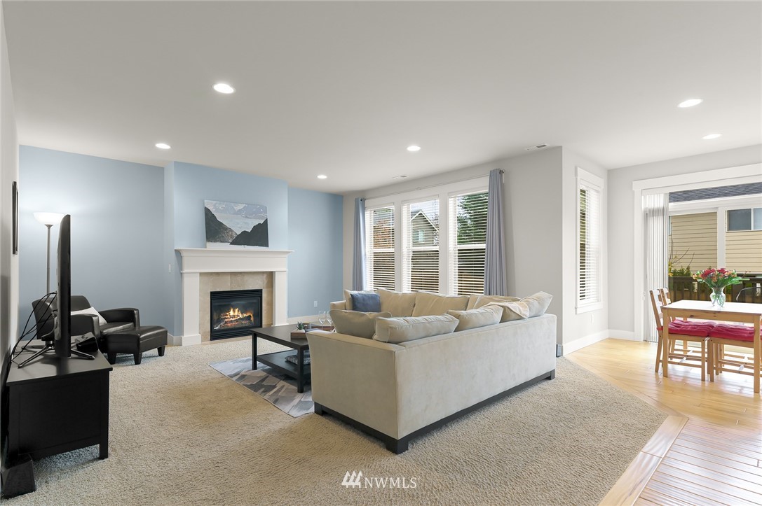 1017 Chelan Place Northeast Renton, WA 98059 - Photo 7 of 40 a living room with furniture and a fireplace