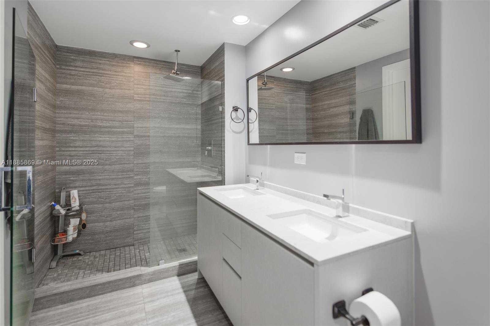 1010 Brickell Avenue, Unit 3608 Miami, FL 33131 - Photo 16 of 48 a bathroom with a sink shower and a mirror