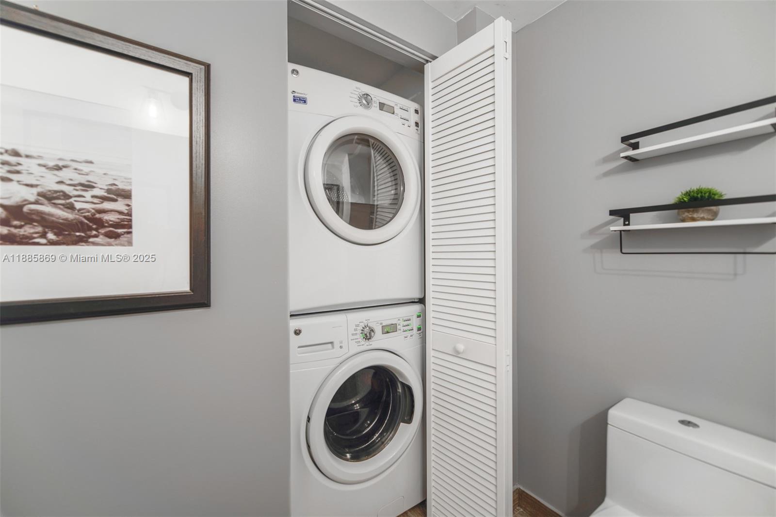 1010 Brickell Avenue, Unit 3608 Miami, FL 33131 - Photo 20 of 48 a view of a hallway with washer and dryer