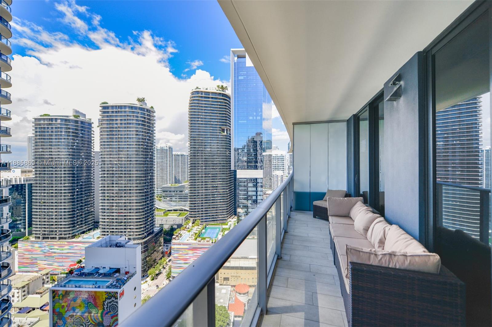 1010 Brickell Avenue, Unit 3608 Miami, FL 33131 - Photo 4 of 48 a balcony with wooden floor and furniture